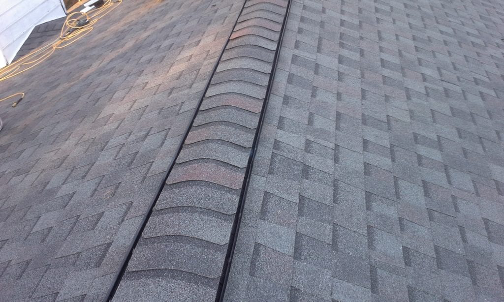 a gray asphalt shingle roof.