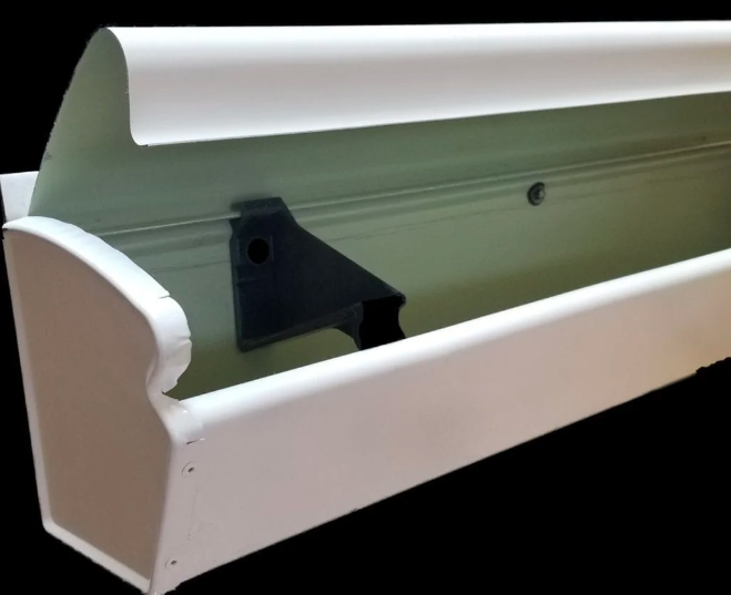 Close-up of a white gutter guard.